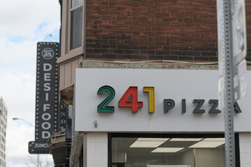Fototapeta premium exterior building side and sign of 241 Pizza located at 1055 Bloor St W, Toronto (Desi Food sign)