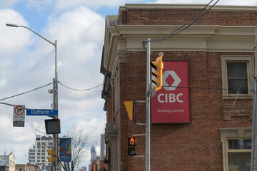 Fototapeta premium exterior building facade and sign at CIBC Branch with ATM located at 1129 Bloor St W, Toronto