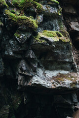 Stones in the forest, covered with moss. Texture of natural stone
