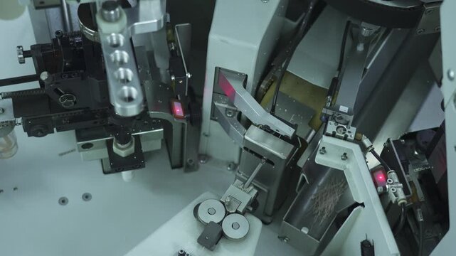 Automatic cable cutting machine cuts cable into pieces. Close-up view