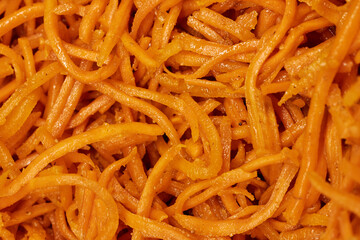 Close-Up of Spicy Korean Carrot Salad &ndash; Fresh Shredded Carrots with Seasoning