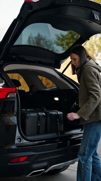 Person putting suitcase baggage into car trunk Travel Luggage Holiday Vacation Preparation Tourism Trip Vehicle Cargo Load
