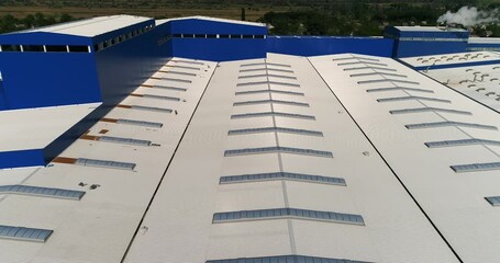 Metal Roofing for industrial and commercial buildings. Metal Roof Skylight Panels for industrial building. Construction of industrial and commercial buildings. Commercial Metal Roofing. Over. Aerial - Powered by Adobe