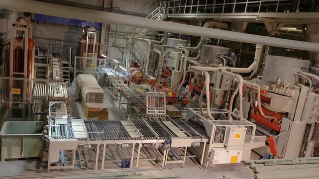 The interior of the Smart Factory is controlled by artificial intelligence. A modern automated plant for the production of ceramic and porcelain tiles. Ceramic Tile Making Machine Conveyer Line. 