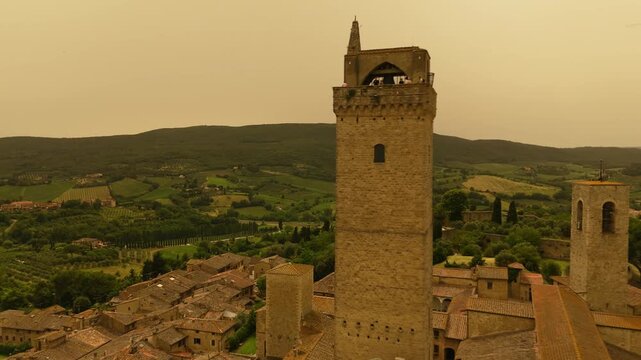 Flying past the towers of the ancient Italian town of San Gimignano