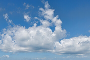 Blue sky with bright white clouds.