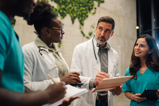 Medical team collaborating and discussing patient data