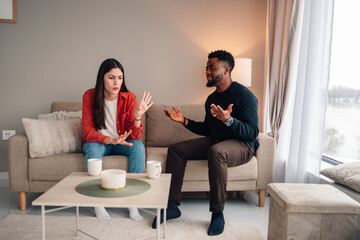 Diverse couple having conflict, discussing relationship problems