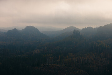 view from the kleiner winterberg saxony switzerland with a lot of fog moody mood foggy cloudy