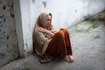Frozen girl sitting on the floor