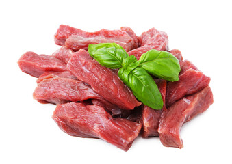 Pieces of raw beef meat and basil isolated on white