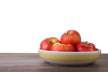Ripe red apples in bowl on wooden table against white background, closeup. Space for text