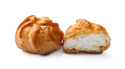 Delicious profiteroles with whipped cream isolated on white