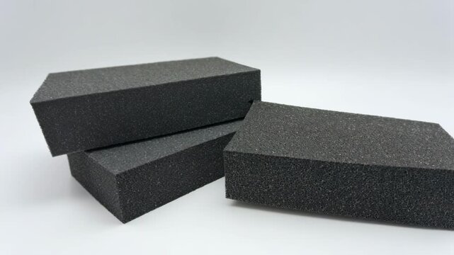 Compact aluminum foam core components showcased in medium shot ideal for durable yet lightweight elements in advanced engineering applications.