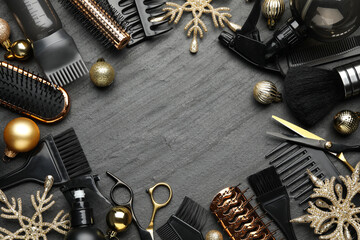 Obraz premium Hairdresser's tools and Christmas decor on black table, flat lay. Space for text