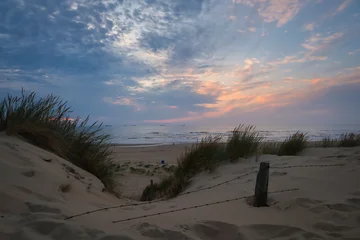 Keuken achterwand Noordzee Sunset view through dune path toward the North Sea at Wassenaarse Slag, Netherlands  © Menyhert