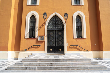 Entrance doors of Agia Kyriaki Church in Pyrgos, Greece, captured on a sunny day