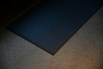 yoga mat on concrete floor