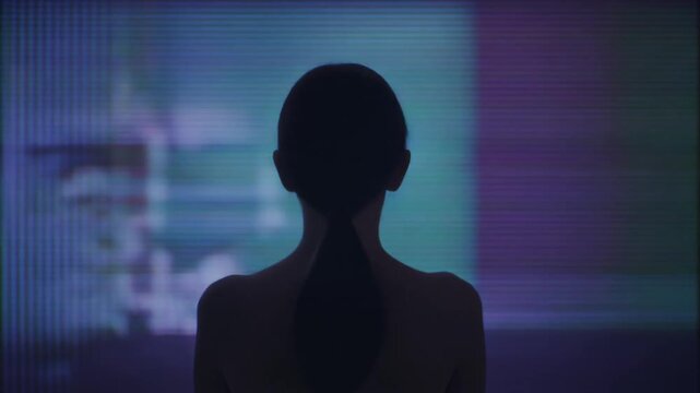 Silhouette in Purple Light - A Mysterious Figure in the Dark.