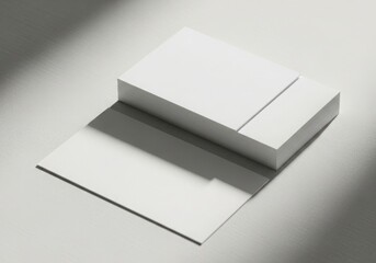 Clean white paper stack with dramatic shadow and light