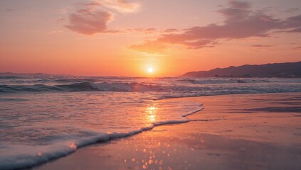 A serene beach scene featuring a vibrant sunset over the ocean with gentle waves and a sandy shore