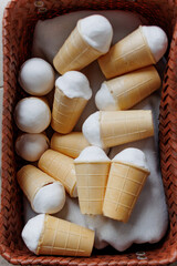 Vanilla ice cream, in a wicker basket, waffle cone, close-up, summer dessert, creamy texture, sweet food, frozen treat
