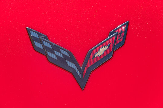 Close-up image of a red Corvette hood, featuring a central emblem in black and white The emblem consists of a shield with the number 1 inside, along with a checke - Kyiv, Ukraine - September 21, 2025