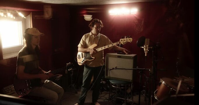 Musicians jamming together in a recording studio