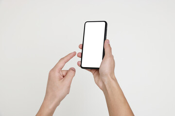 Man holding smartphone with blank screen on white background, closeup. Mockup for design