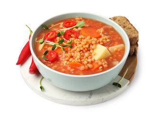 Delicious lentil soup with vegetables and bread isolated on white