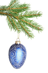 Christmas bauble with pattern hanging on fir tree branch isolated on white