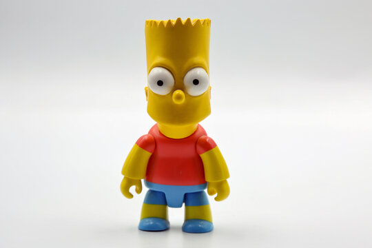 Bart Simpson toy figure closeup on white background.