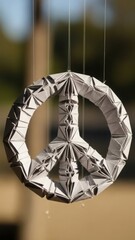 Textured three-dimensional peace symbol with intricate folds hanging gently symbolizing hope for global harmony