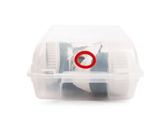 Pair of sneakers in plastic box isolated on white. Shoe storage