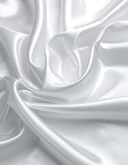 Obraz premium Lustrous white fabric with elegant folds and soft shadows