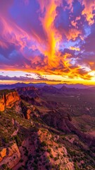 Obraz premium Dramatic desert mountain vista ablaze with vibrant sunset colors