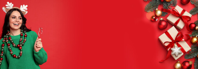 Christmas banner design with happy woman and gift boxes on red background. Space for text