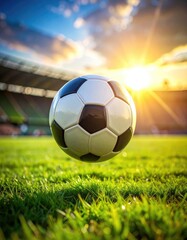 Fototapeta premium Soccer ball suspended above grass field with stadium background and bright sunlight