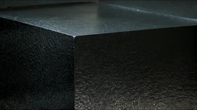 Medium perspective capturing responsive engravings perfectly adjusting their appearance as the light angle shifts enhancing the textured surface with radiant reflections.
