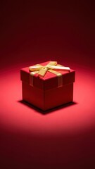 Luxurious red gift box with golden bow on a vibrant red background perfect for special occasions