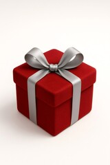 Fototapeta premium Red velvet gift box featuring a silver satin ribbon and bow, symbolizing holidays, anniversaries, and surprise moments