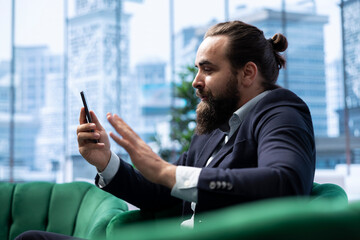 Skilled empowered male CEO negotiating with shareholders on online call, asking for more funds to sustain an expansion project. Businessman director driven for success, leadership skills.