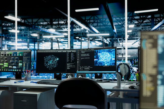Close up of AI software interface on PC monitors in data center with mainframes hosting cloud services. Computers used for deploying deep learning algorithms in server farm used for automation tasks