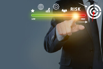 Man regulating level of risk on virtual screen with icons against grey background, closeup