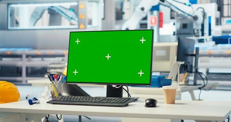 Chroma key PC in solar panels manufacturing plant used to develop new technologies harnessing sun power. Green screen computer in empty photovoltaics factory used to improve efficiency