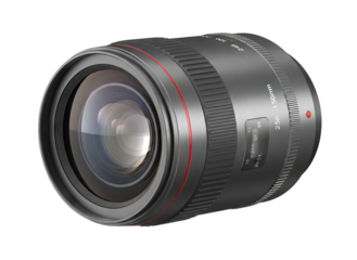 A black camera lens with red accents and intricate details photographed on a black background