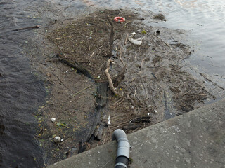 Rubbish floating on the River Clyde in Glasgow polluting the water