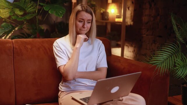 Sad young woman talk with psychotherapist at online distance remote counselling session indoors Depressed girl discussing problem with psychological support by laptop computer at home