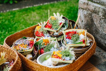 Close-up of traditional offerings called Canang Sari in woven baskets