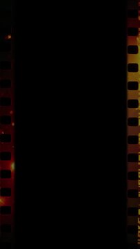 Vertical Super 8 16mm style film strip with perforations. High quality 4k footage